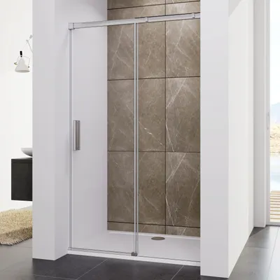 A modern bathroom shower enclosure with a sliding glass door.