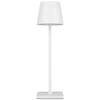 A white cordless LED table lamp with a square base and a conical shade is shown against a white background.
