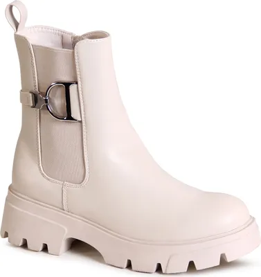 A single beige Chelsea boot with a platform sole and a decorative buckle is shown against a white background.