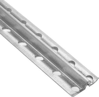 A close-up, angled view of a metal construction profile with multiple holes.