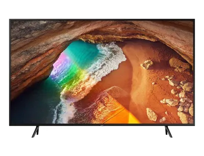 A Samsung smart TV displaying a colorful image of a beach cave.