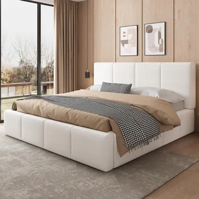 A bedroom scene with a bed, window, and artwork.