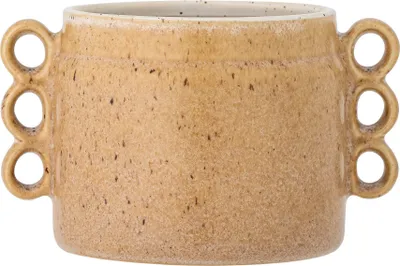 A close-up studio shot of a ceramic planter.