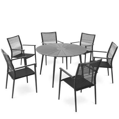 A round dining table with six chairs, set against a white background.