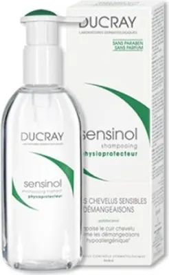 A bottle of Ducray Sensinol shampoo next to its packaging.