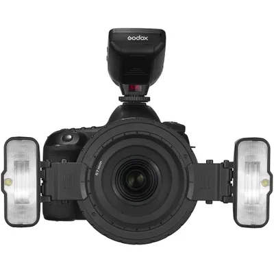 A top-down view of a camera with multiple flashes attached.