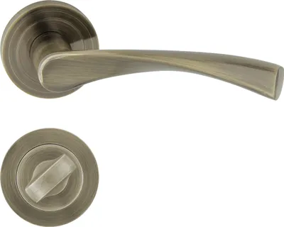 Produktbild von DOMINO Türgriff Drückergarnitur WC - Badezimmer Set | Rund-Rosette | Türbeschlag für Badezimmertüren | Set WC - Rosetten-Garnitur | Türklinke aus Aluminium | Bronze Türdrückergarnitur | ROMANA-R M3