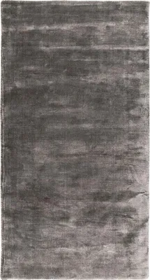 A close-up, top-down view of a gray rug.