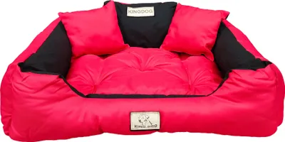 A red and black dog bed with raised sides and a central cushion.