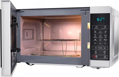 An open microwave oven interior with racks.