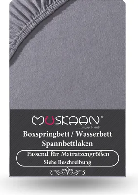 A close-up of a grey fitted sheet with elasticated corners, with branding and product information below.