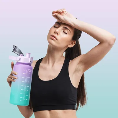 Imagen del producto de Botella de agua de 2 litros, sin BPA, color rosa, con indicador de tiempo, ideal para deportes y actividades al aire libre