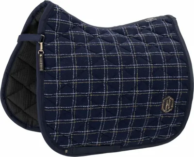 A close-up, studio shot of a navy blue saddle pad with a plaid pattern.
