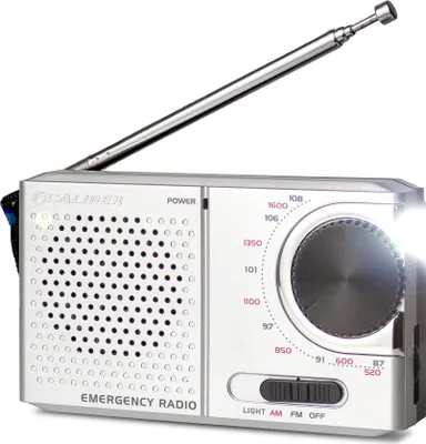 A silver emergency radio with an extended antenna and a flashlight emitting light.