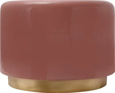 A close-up studio shot of a round side table with a rose-colored top and a gold base.