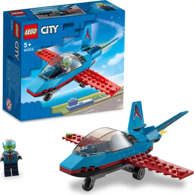 A LEGO City Stunt Plane set, including the box and the assembled plane with a pilot minifigure.