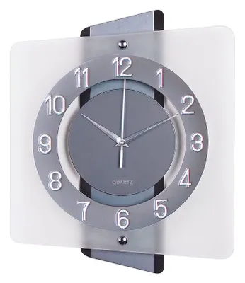 A modern wall clock with a circular face and silver-toned numbers.