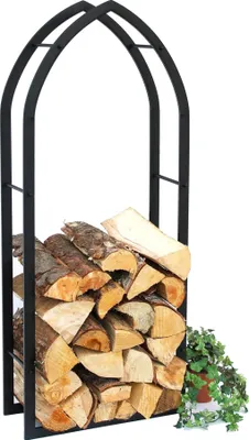 A black metal firewood rack filled with logs, with a small potted plant to the right.