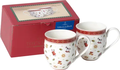 A set of two Villeroy & Boch Toy's Delight mugs are displayed next to their red packaging box.