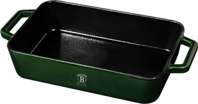 A green cast iron baking dish with black interior and handles, shown from a slightly elevated angle against a white background.