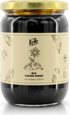 A glass jar of Yacon Syrup with a label.
