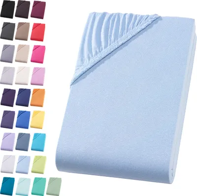 A light blue fitted sheet is displayed on a white background, with a swatch of other colors shown on the left.