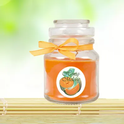 Obrázek produktu pro Vonná svíčka ve sklenici s vůní medového melounu, 10 x Ø7 cm – malá sklenice ve tvaru bonbónu s víčkem, doba hoření cca 30 hodin, dárková dekorace do interiéru