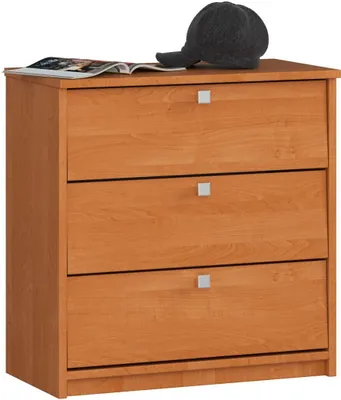 A wooden shoe cabinet with three drawers is shown against a white background. A dark gray baseball cap and an open magazine are placed on top of the cabinet.