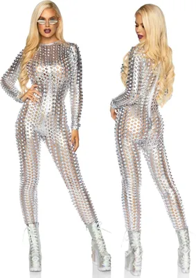 A woman modeling a silver, metallic, laser-cut catsuit with matching boots and sunglasses.