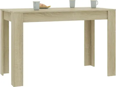 A light brown wooden dining table against a white background.