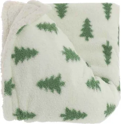 A folded blanket with a Christmas tree pattern.