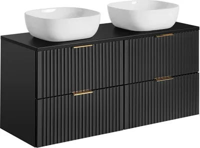 A black bathroom vanity with two white vessel sinks on top.