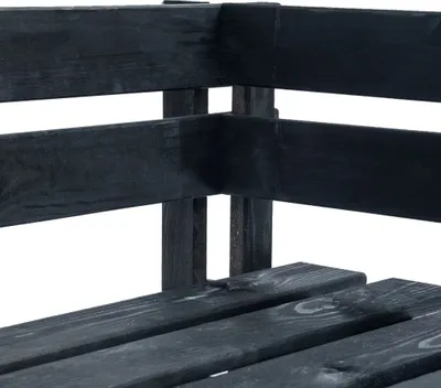 A close-up view of the corner of a black wooden outdoor corner bench, showing the construction of the slats and supports.