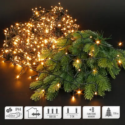 A cluster of warm white LED lights is draped over a pine branch, with several informational icons at the bottom.