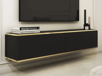 A black TV cabinet mounted on a white wall, with a TV above it.