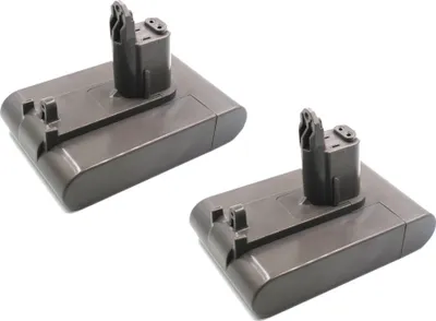 Two gray Dyson vacuum cleaner batteries are shown against a white background.