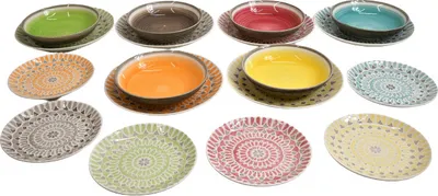 A collection of colorful ceramic bowls and plates arranged in rows.