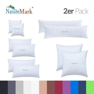 A collection of white pillows and pillowcases of various sizes, arranged on a white background, with a brand logo and text overlay.