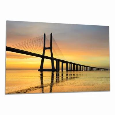Produktbild von Wallario Herdabdeckplatte aus Glas, Größe 80 x 52 cm 1-teilig, Motiv Vasco da Gama Brücke