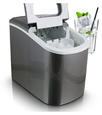 A dark gray ice maker with its lid open, showing ice cubes inside. A glass of ice water with mint and a straw is visible to the right.