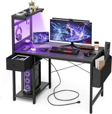 Imagen del producto de Escritorio para juegos - Escritorio con espacio de almacenamiento - Ideal para trabajar y jugar en casa - Con enchufes integrados - 100 x 50 cm - Negro