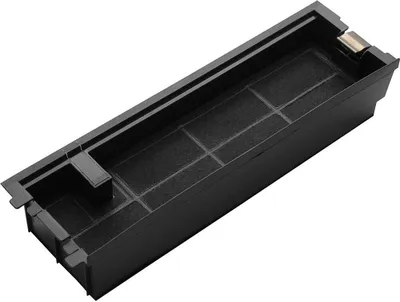 A black filter tray with internal dividers and a charcoal-like filter material.
