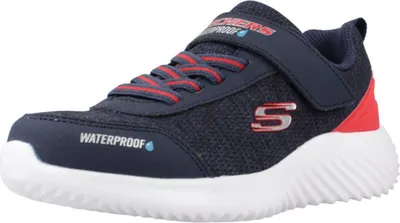 A single navy blue Skechers sneaker with red accents and white sole is shown against a white background.