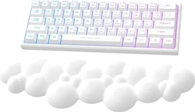 A white keyboard and a white cloud-shaped wrist rest are shown against a white background.
