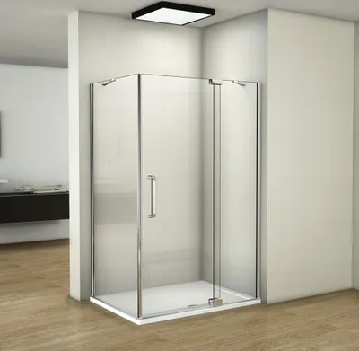 A modern bathroom with a glass shower enclosure.