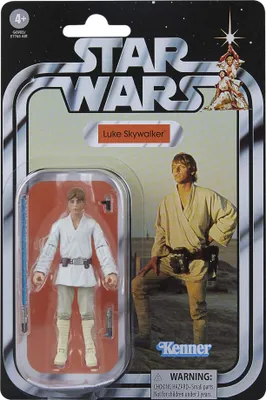 A Star Wars action figure of Luke Skywalker in its original packaging, with the figure visible in a plastic bubble and a promotional image of the character on the right.