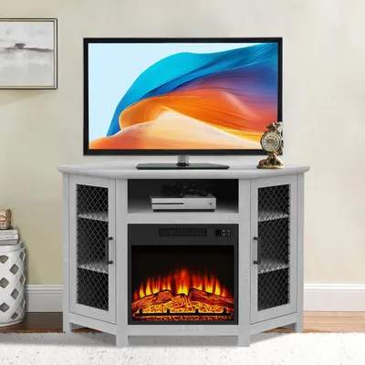 A gray corner TV stand with an electric fireplace and a television on top.