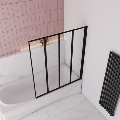 A modern bathroom with a bathtub and a shower screen.