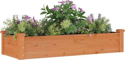A wooden planter box filled with artificial plants.