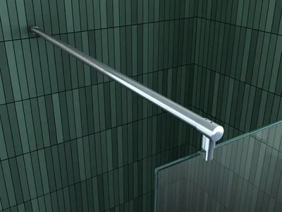 A silver handle bar mounted on a green tiled wall, next to a glass panel.